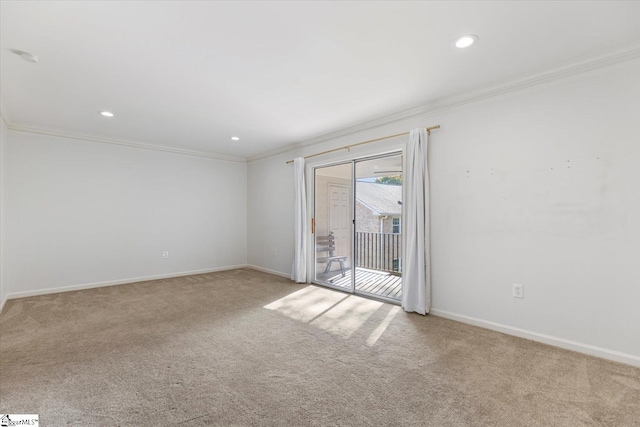 carpeted spare room with ornamental molding