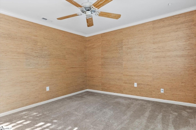 unfurnished room featuring crown molding, carpet, and ceiling fan