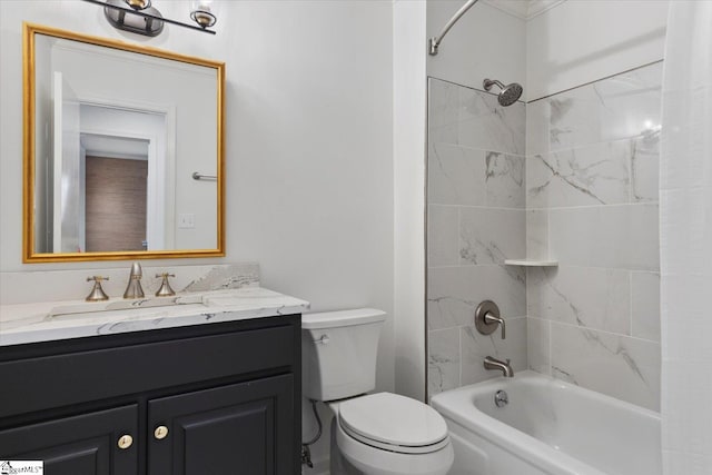 full bathroom with vanity, toilet, and tiled shower / bath