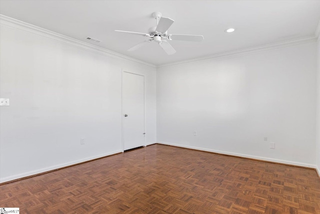 unfurnished room featuring dark parquet flooring, ornamental molding, and ceiling fan