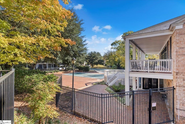 exterior space featuring a fenced in pool and a patio area