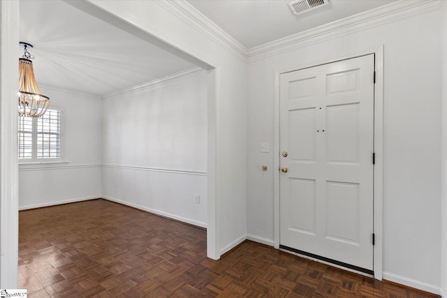 entrance foyer featuring a notable chandelier, ornamental molding, and dark parquet flooring