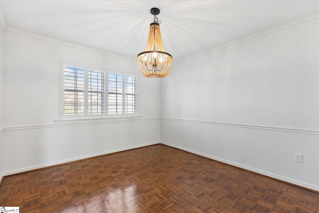 spare room with ornamental molding, an inviting chandelier, and dark parquet flooring