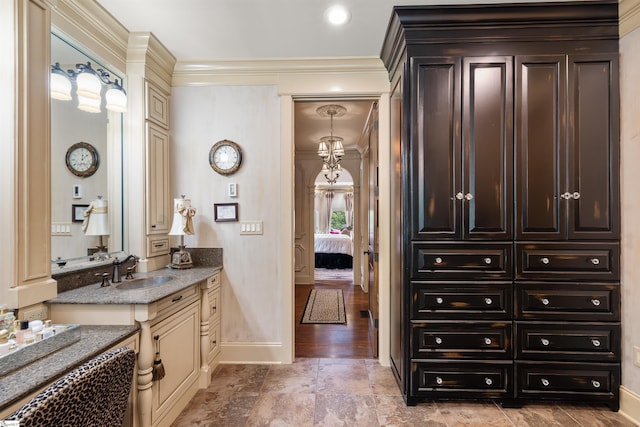 bathroom with vanity, crown molding, and wood-type flooring