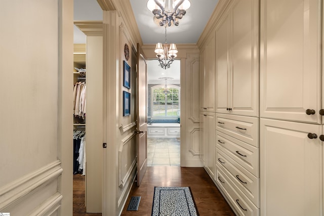 interior space with a chandelier and dark wood-type flooring