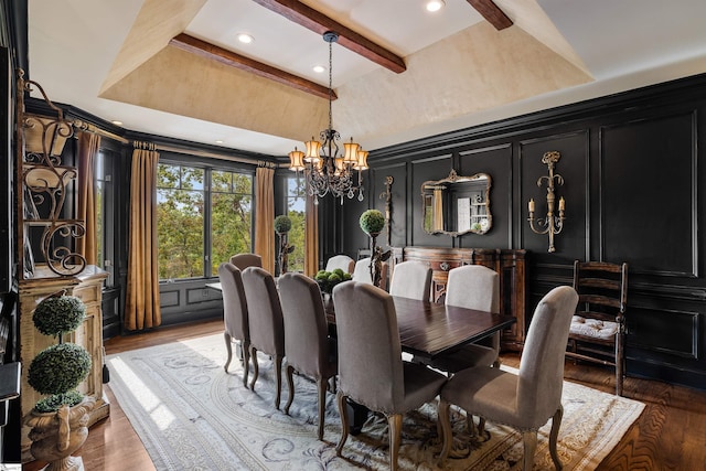 dining room with dark wood-type flooring, beam ceiling, and a chandelier