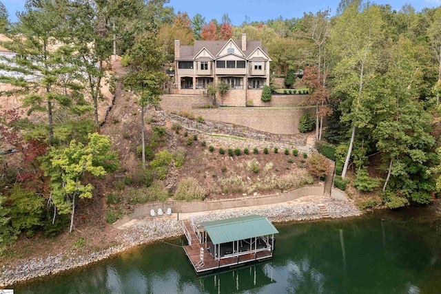 rear view of house with a water view