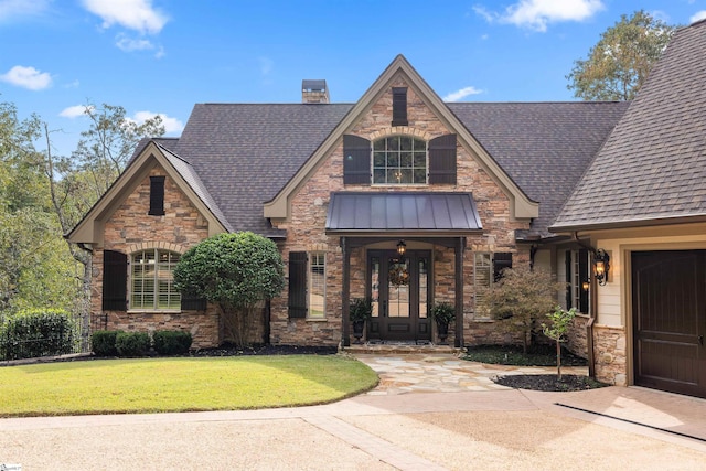 view of front facade with a garage and a front lawn