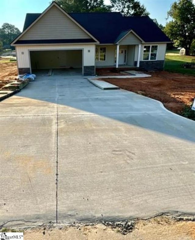 single story home featuring a garage