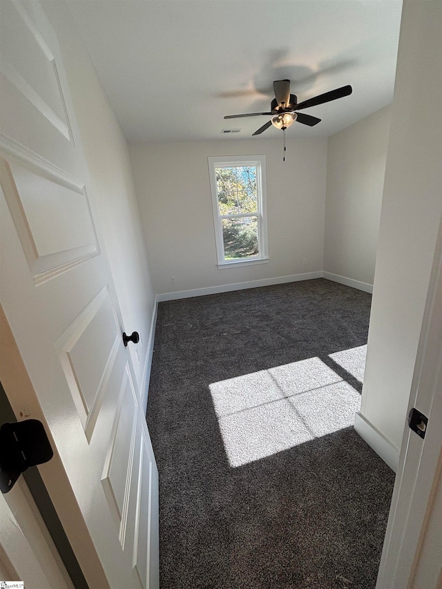 carpeted empty room with ceiling fan