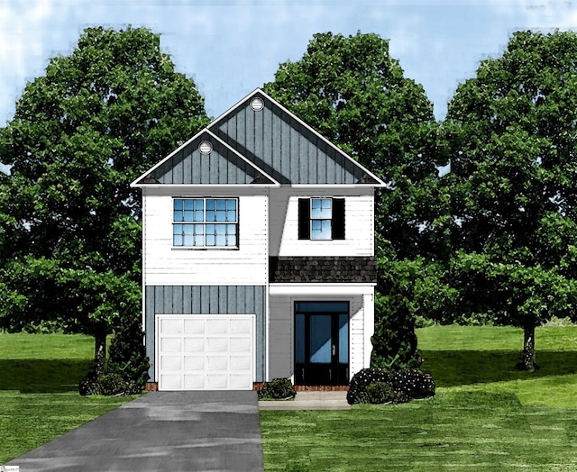 view of front of house with a garage and a front lawn