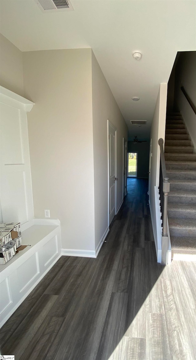 hall with dark wood-type flooring