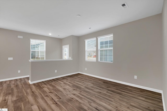 spare room featuring hardwood / wood-style flooring