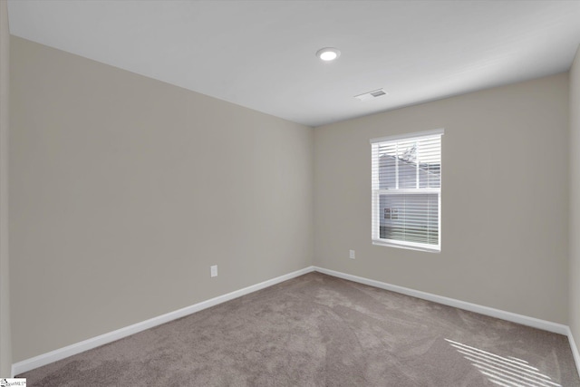 view of carpeted spare room