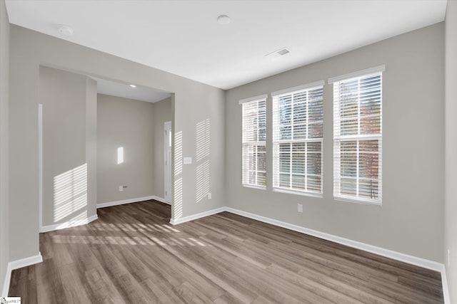 empty room featuring wood-type flooring