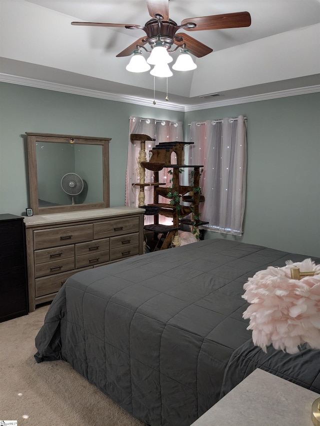 carpeted bedroom featuring ceiling fan and crown molding