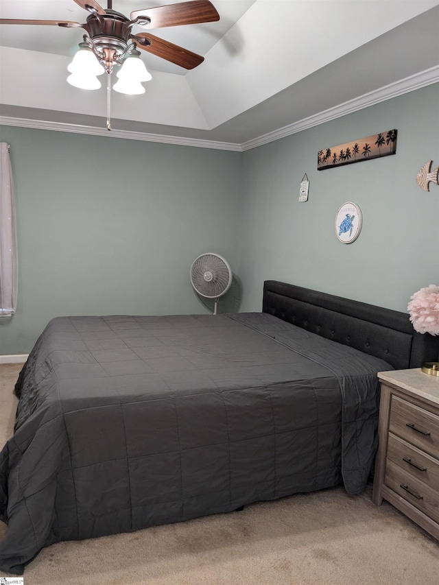 bedroom featuring ceiling fan, light carpet, a raised ceiling, and ornamental molding