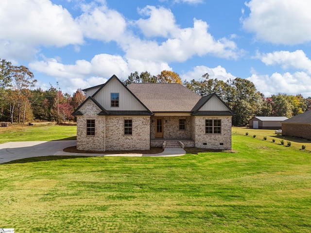 back of property with a lawn