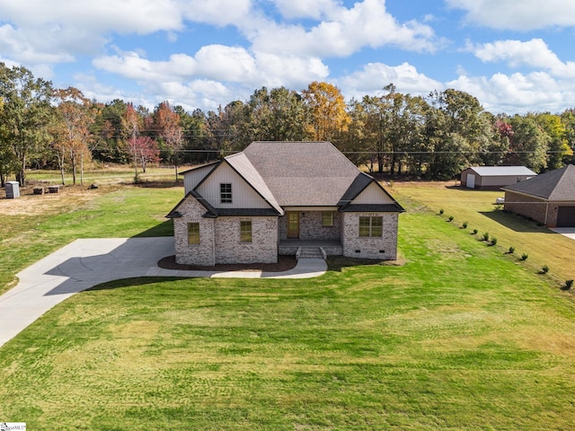 view of front of house featuring a garage and a front lawn