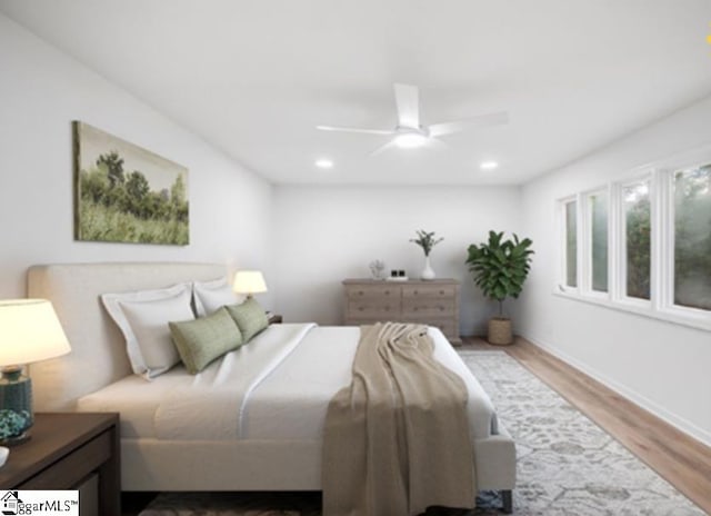 bedroom featuring ceiling fan and hardwood / wood-style floors