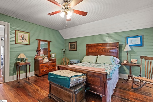 bedroom with ceiling fan, lofted ceiling, and dark hardwood / wood-style flooring