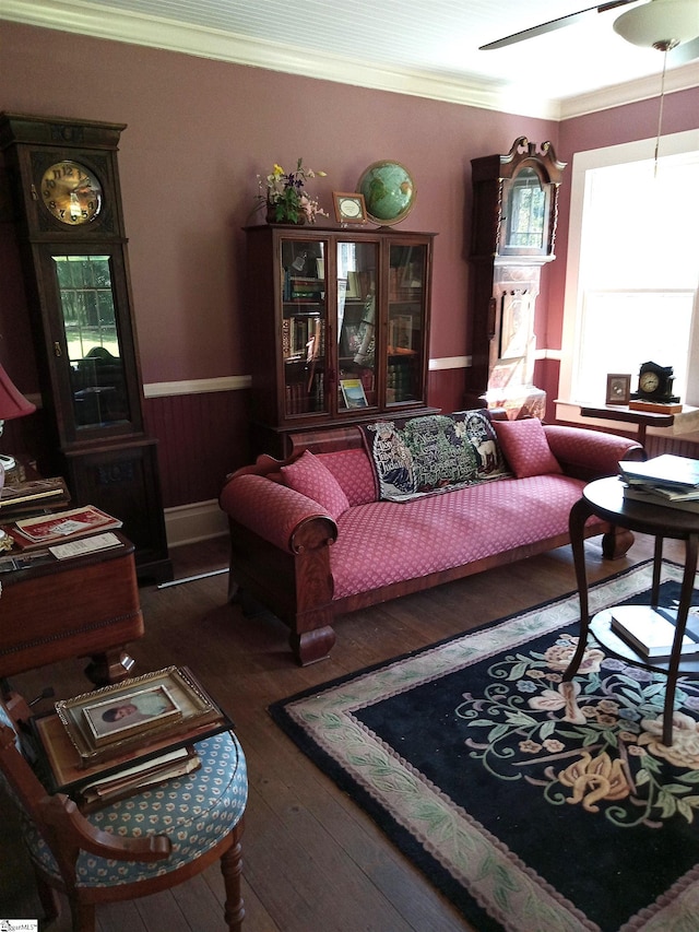 living room with ornamental molding and dark hardwood / wood-style flooring