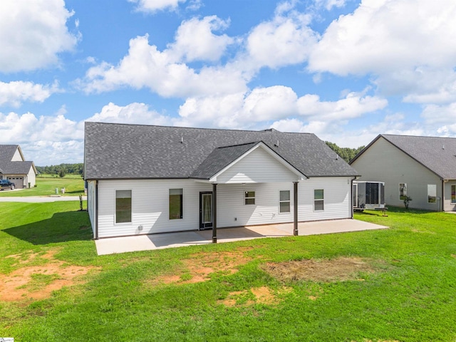 back of property with a patio and a yard