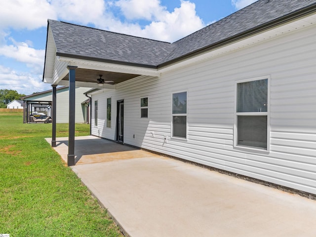 exterior space with a yard, ceiling fan, and a patio