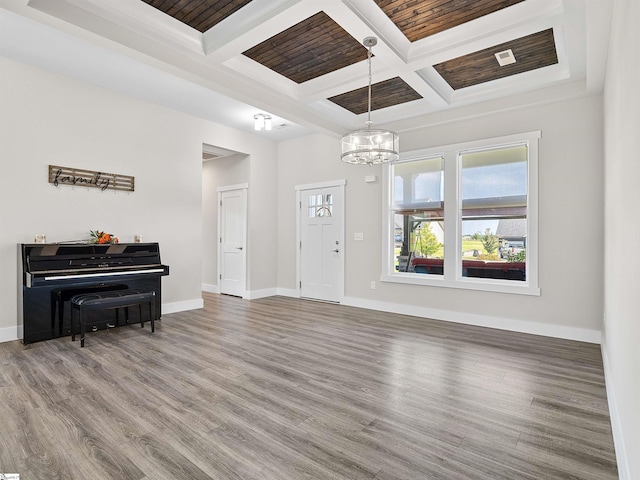 entryway featuring coffered ceiling, beam ceiling, wooden ceiling, hardwood / wood-style floors, and a chandelier