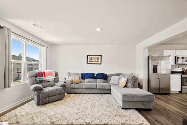 living room featuring dark hardwood / wood-style floors