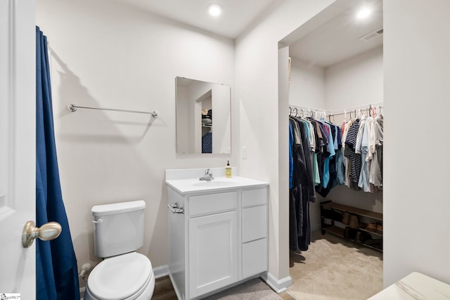 bathroom featuring vanity and toilet