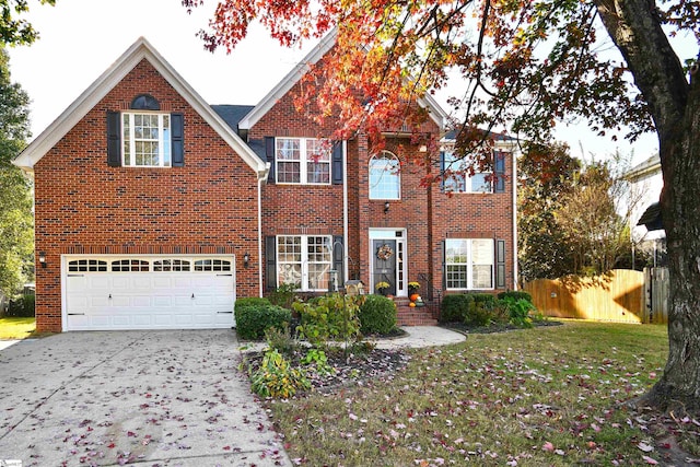 view of front of house featuring a front yard and a garage