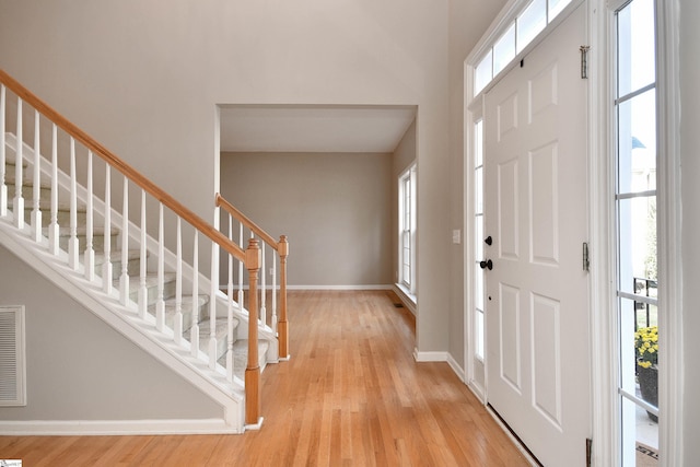 foyer with light hardwood / wood-style floors