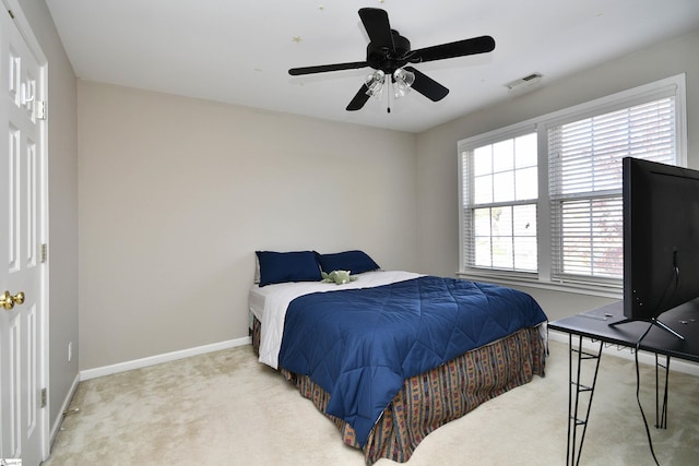 bedroom with light colored carpet and ceiling fan