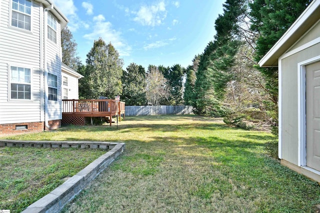 view of yard featuring a wooden deck