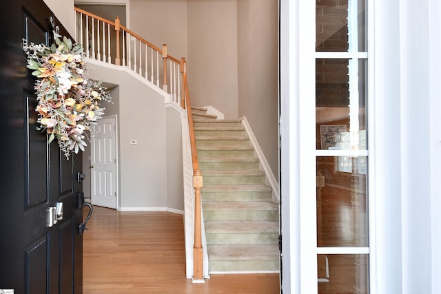 foyer entrance with hardwood / wood-style floors