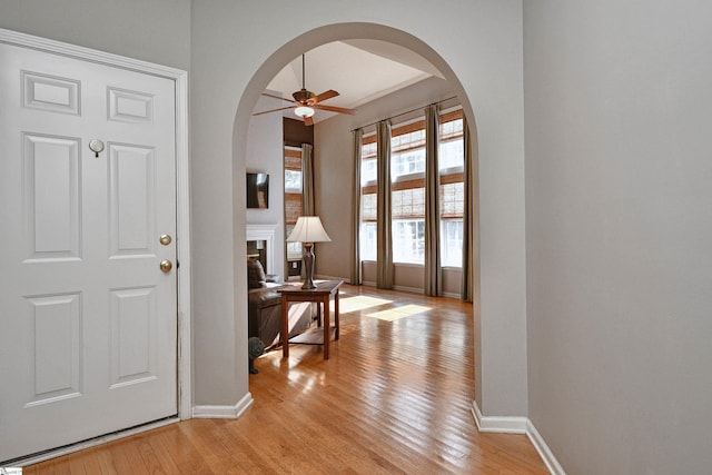 entrance foyer with light wood-type flooring and ceiling fan