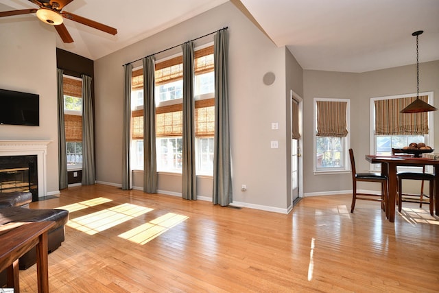 living room with ceiling fan and light wood-type flooring