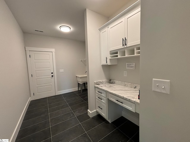 washroom featuring dark tile patterned floors