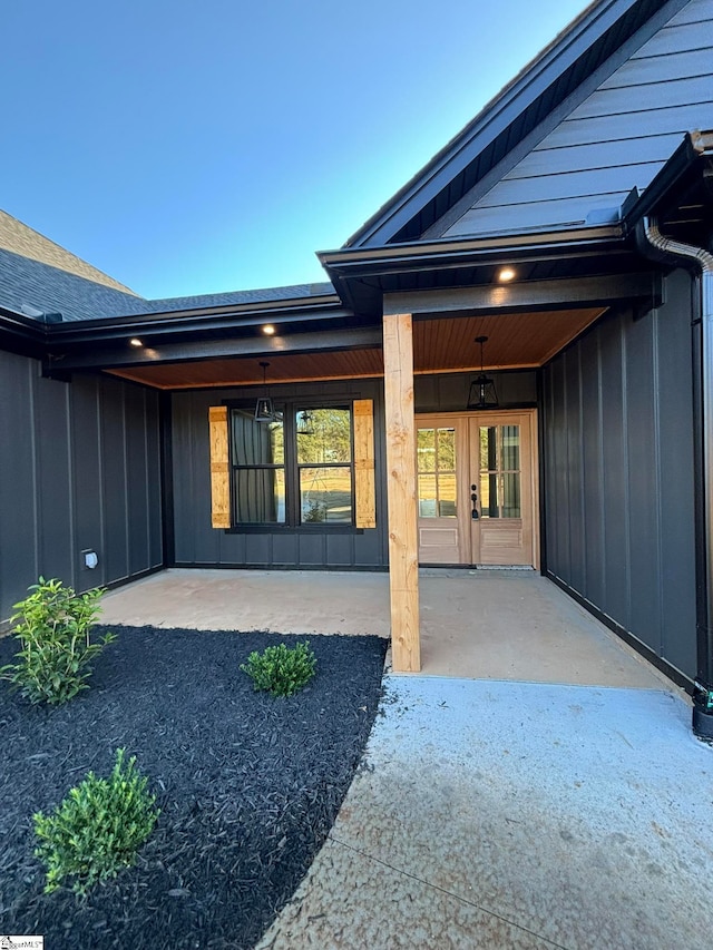 view of exterior entry featuring a patio