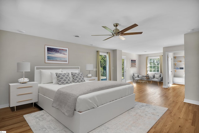 bedroom featuring hardwood / wood-style floors and ceiling fan