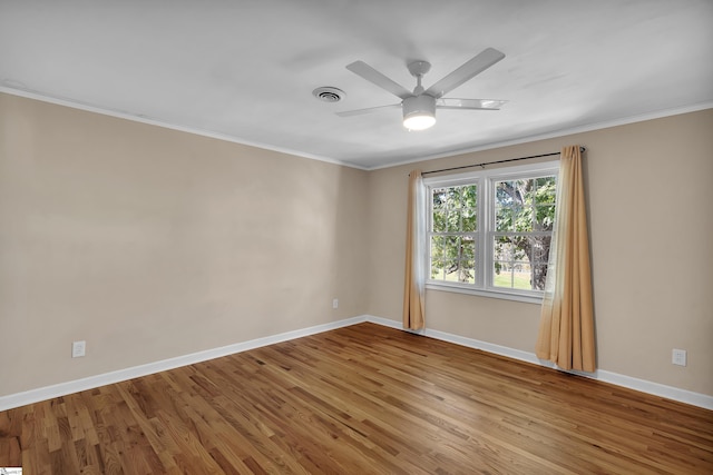 unfurnished room with ornamental molding, light hardwood / wood-style floors, and ceiling fan