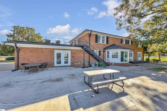 back of house with a patio and french doors