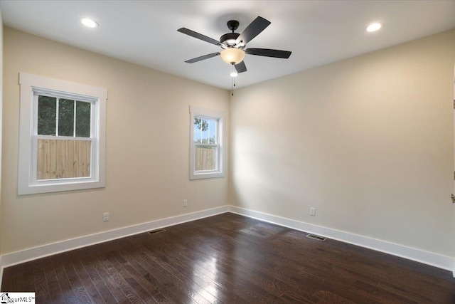 unfurnished room with dark wood-type flooring and ceiling fan