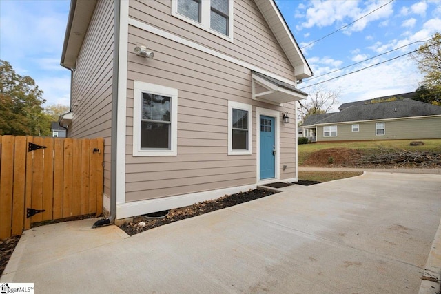 view of side of property with a patio area