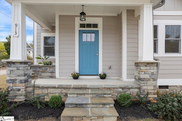 property entrance featuring covered porch