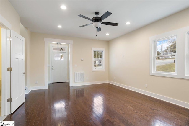 entryway featuring ceiling fan, dark hardwood / wood-style flooring, and plenty of natural light