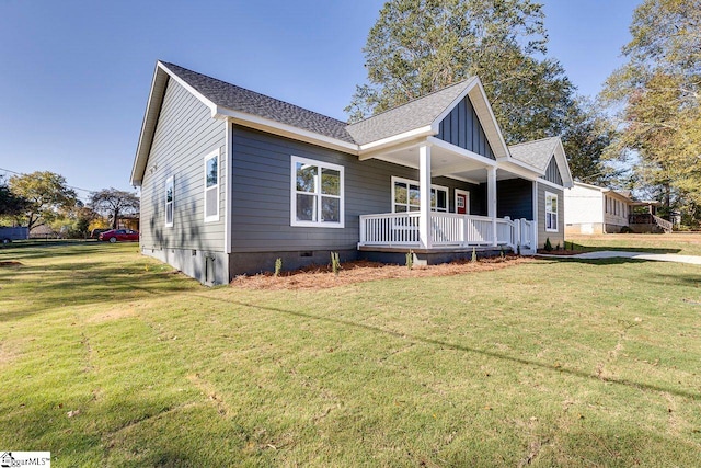 view of property exterior featuring a porch and a lawn