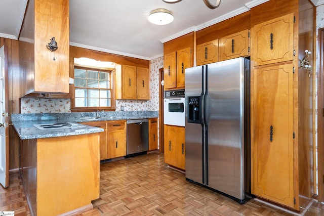 kitchen with light parquet flooring, appliances with stainless steel finishes, ornamental molding, and tasteful backsplash