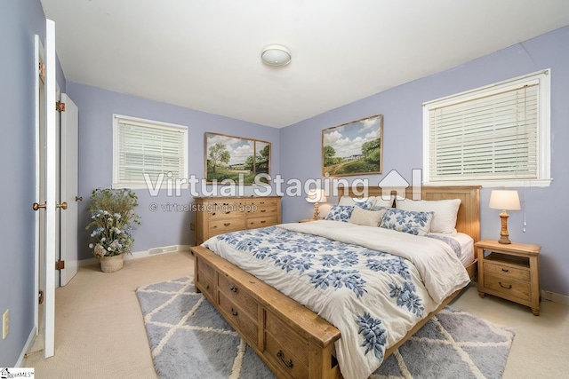 bedroom with light colored carpet